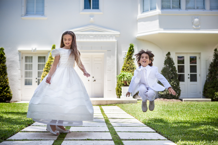 Children jumping in a garden