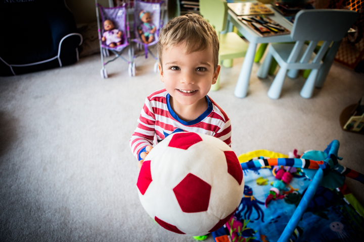 Child holding a football