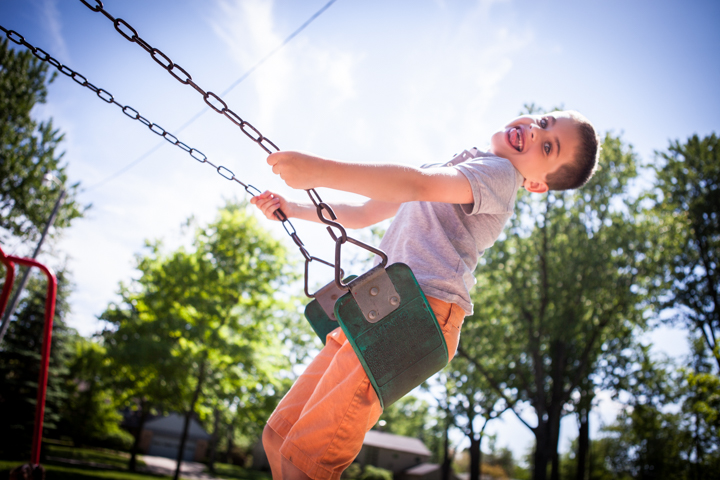 Child on a garden swing