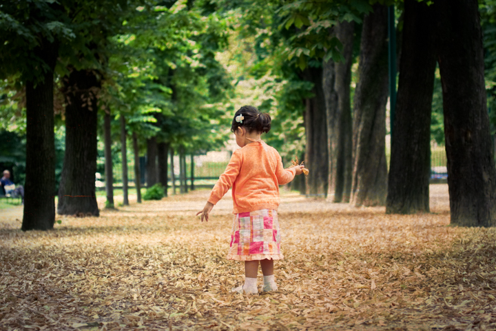 Child running among trees