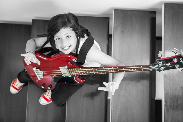 Child playing a guitar