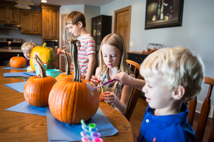 Children decorating pumpkins