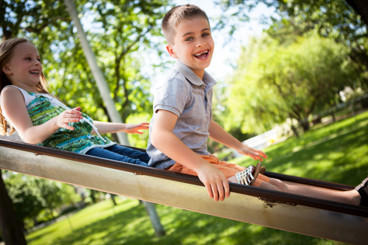 Child playing on garden equipment