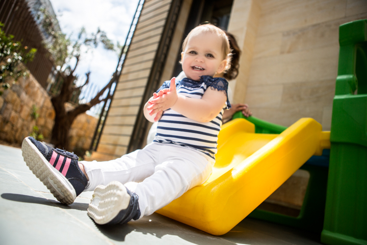 Child enjoying a playground slide