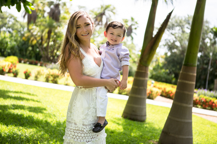 Mother holding her child in a garden