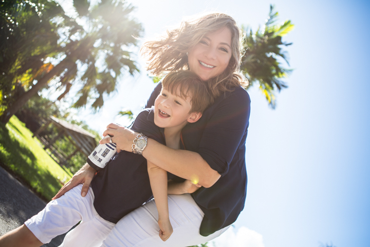 Parent and child embracing outdoors